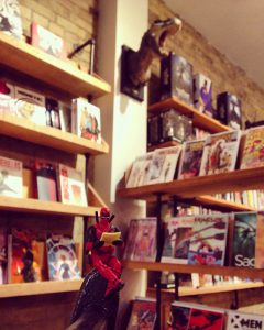 comic book store coffee bar comics deadpool shelves interior design